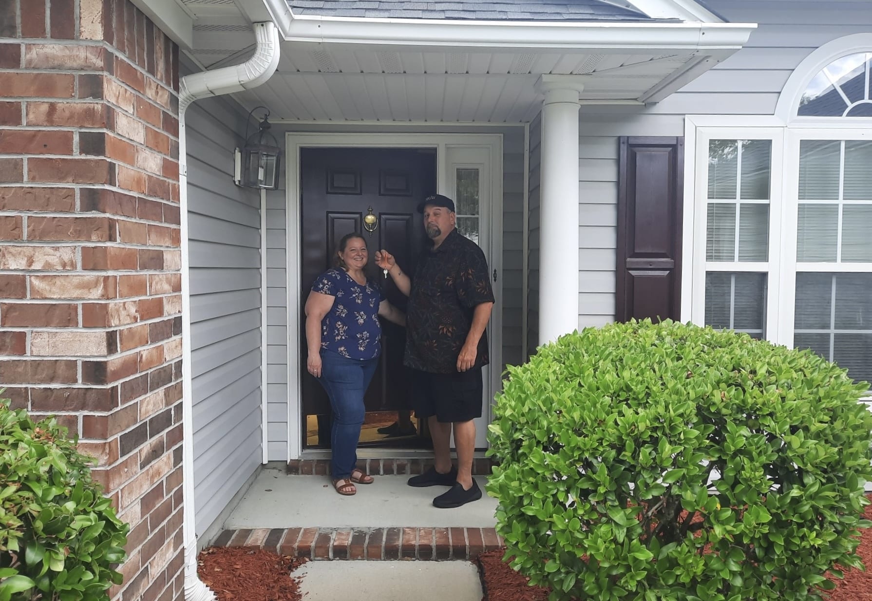 opening the door to their new home after using fairways certified pre-approval