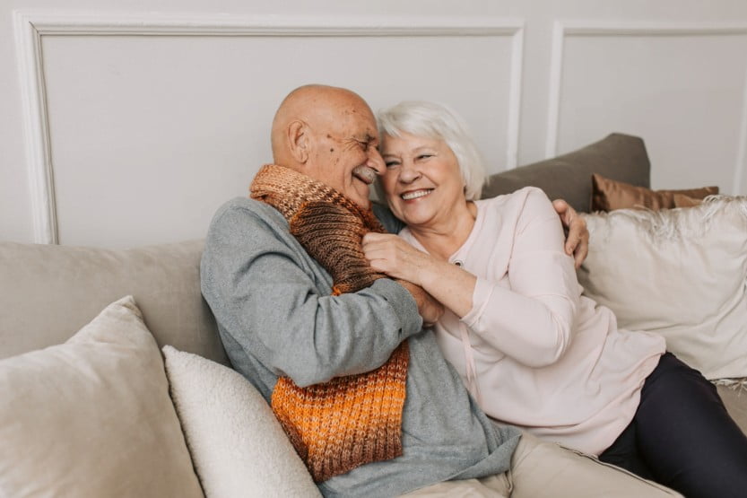 older couple embracing on couch